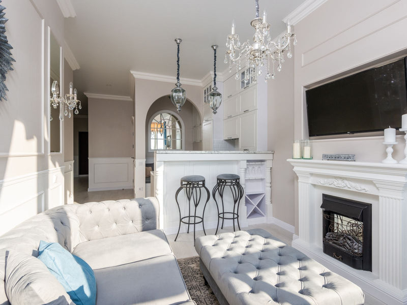 Bright, comfortable living room in a family home with a sofa and fireplace